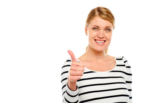 Cool teenager showing thumbs-up gesture against white background