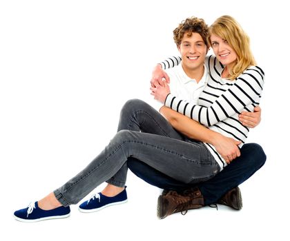 Girl sitting on her boyfriends lap. Adorable love couple