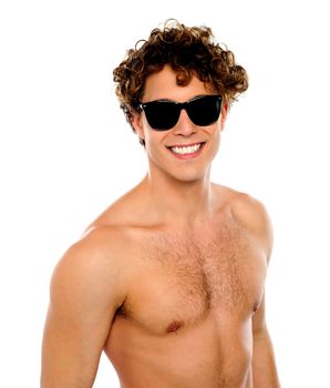 Shirtless guy with sunglasses, closeup shot. Smiling