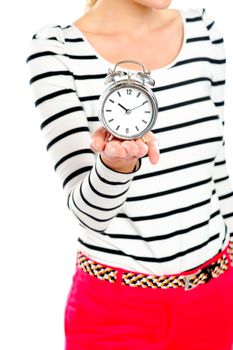 Cropped image of a woman holding alarm clock. Focus on clock