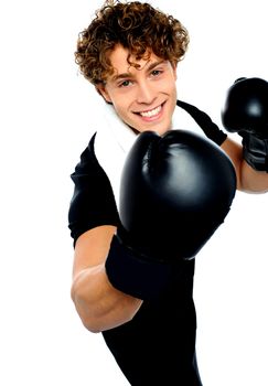 Young man with black boxing gloves and aggressive action