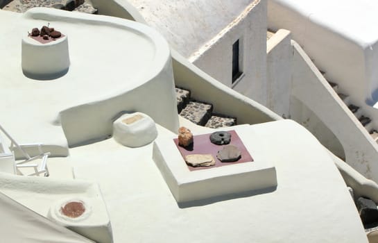 Close up on white architecutre with stairs, window and roof at Oia, Santorini, Greece, by sunny day.