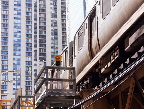 Chicago train on the overhead track of Loop with skyscrapers
