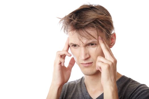 Man suffering from headache on a white background