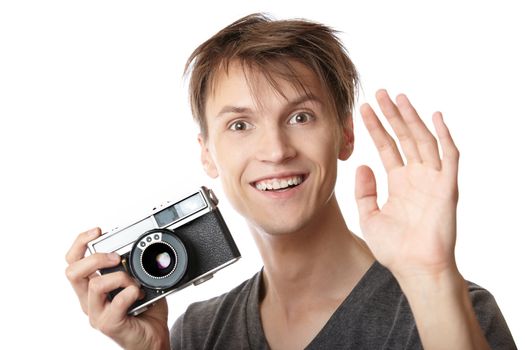 Young photographer holding vintage film photo camera