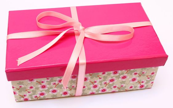 pink present with a flower base box with a pink ribbon
