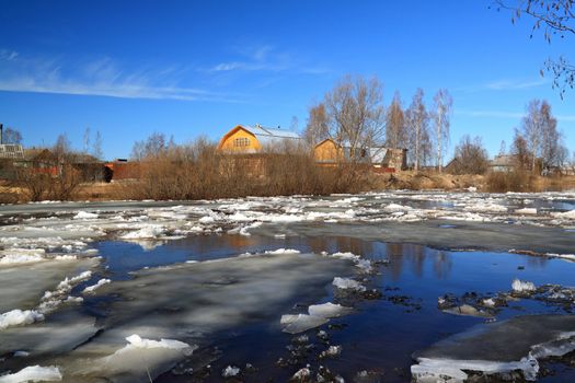 driving of ice on river near villages