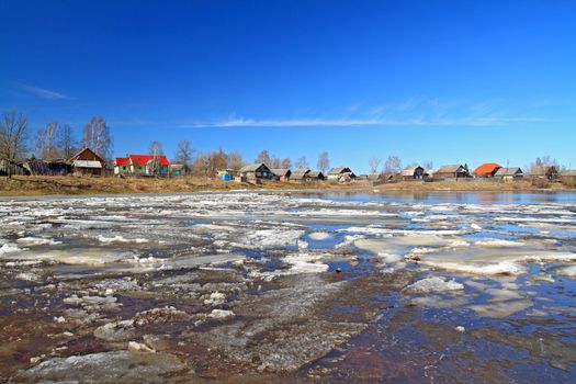 driving of ice on river near villages