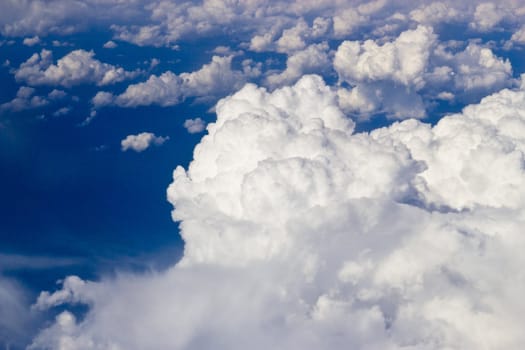 White clouds in the dark blue sky