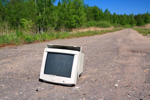 brokenned computer on old road