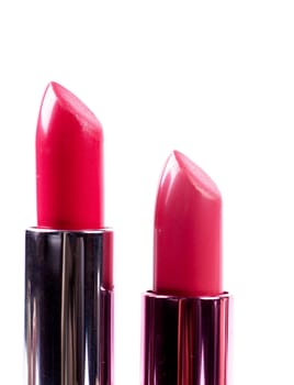 Red lipsticks isolated over white background
