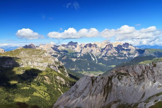 summer view of Monzoni valley with Catinaccio mount on background, Italian Dolomites