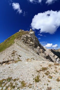 white clouds over mountain summit in Italian Dolomites