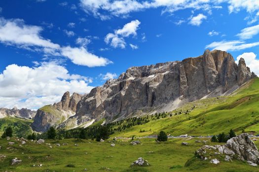summer landscape of Sella mountain and Gardena valley from Sella pass, Italian Dolomites