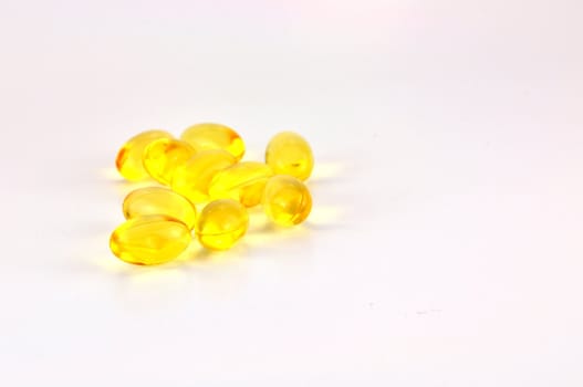 Fish oil pills on white background 