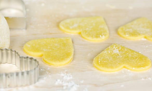 Making heart shaped shortbread cookies with cutters