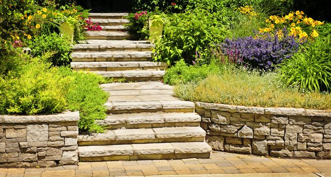 Natural stone landscaping in home garden with stairs