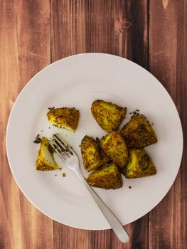 close up of a plate of crusty baked potatoes