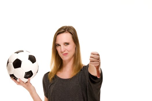 woman holding a soccer ball showing thumbs down on white background