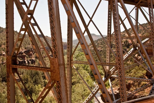 Rusted metal bridge spans Oak Creek Canyon, Arizona