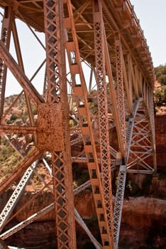 Rusted metal bridge spans Oak Creek Canyon, Arizona