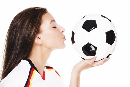 young beautiful woman about to kiss a football on white background
