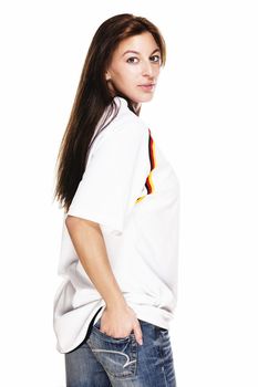 young woman wearing blue jeans and football shirt turning around on white background