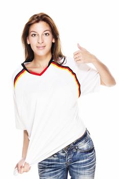 young woman wearing jeans and football shirt showing thumb up on white background