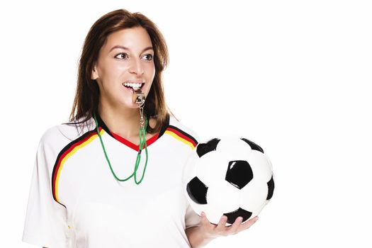 beautiful woman wearing football shirt with a whistle holding football on white background