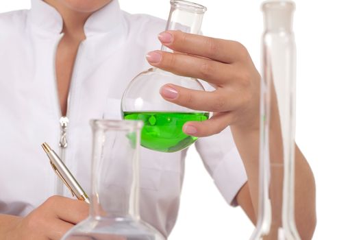 young woman scientist  chemist mixes the liquid in the tubes