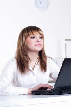 Young busines woman with notebook, in office