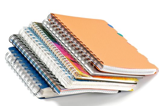 Stack of Color Spiral notepads isolated on white background