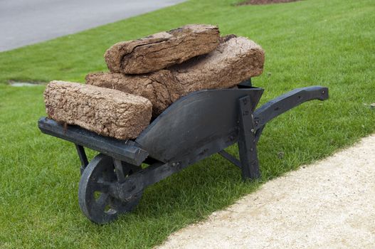 landscape with wheelbarrow with peat