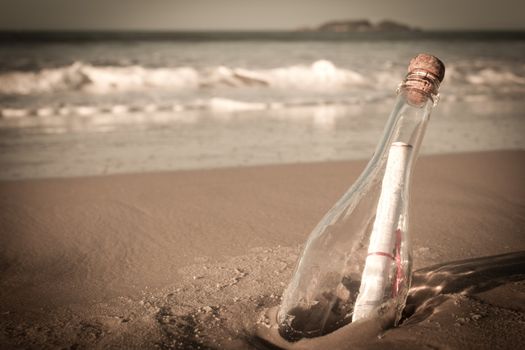 A message inside a glass bottle, washed up on a remote beach.