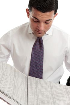 An investment banker, or stockbroker reading the finance sharemarket pages of the newspaper.