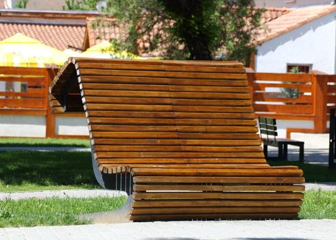 interesting wood and metal made bank in the park