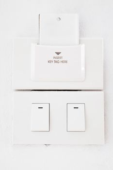 light switch and blank key tag on wall