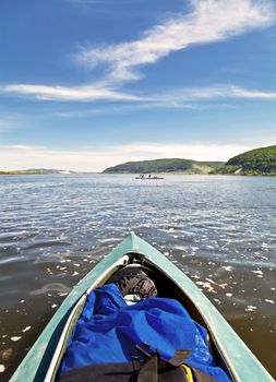 Bow of the boat and the landscape with blue sky. The Volga River. Samara.