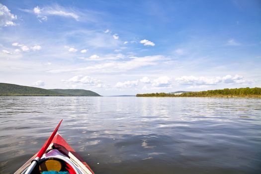 kayak on the water. Against the background of Zhiguli Mountains. The Volga River near Samara. 
