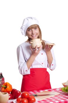 beautiful woman looking into a pot of food, cooking vegetables