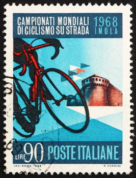 ITALY - CIRCA 1968: a stamp printed in the Italy shows Bicycle and Sforza Castle, Imola, the Road Championships at Imola, circa 1968