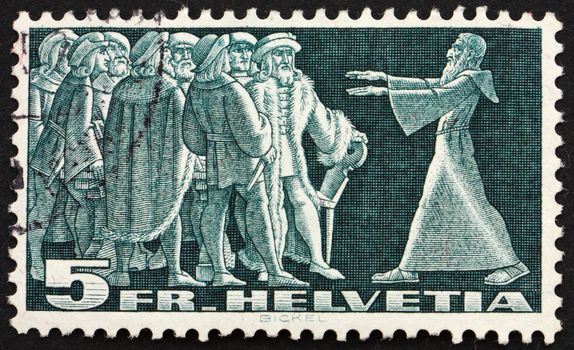 SWITZERLAND - CIRCA 1938: a stamp printed in the Switzerland shows Diet of Stans, 1481, Message from the Hermit Nikklaus von Flue, circa 1938