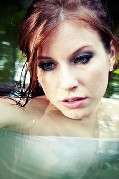 A close up of a beautiful woman in water