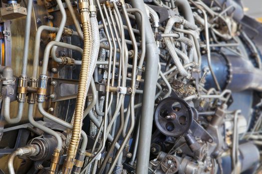 The complicated plumbing of tubing inside a jet engine