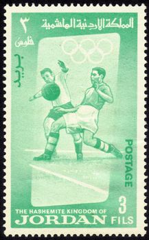 Jordan - CIRCA 1956: a stamp printed by Jordan shows football players. Olympic Games , series, circa 1956