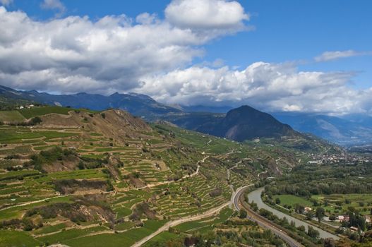 majestic views of the valley with a river in the mountainous switzerland