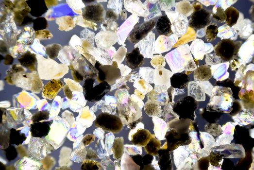 micro photo: grain of sand in polarized light