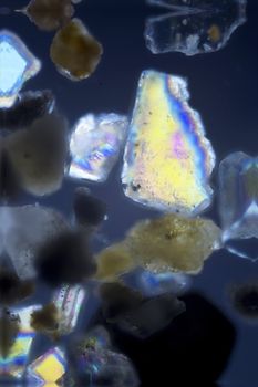 micro photo: grain of sand in polarized light