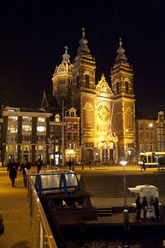 scene in the old town of amsterdam, netherlands by night