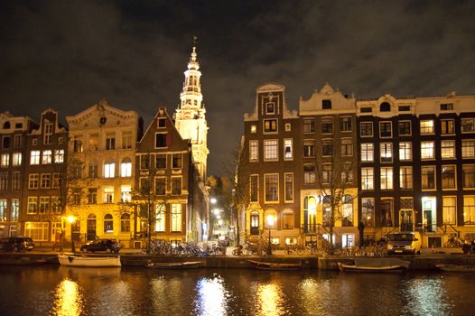 scene in the old town of amsterdam, netherlands by night